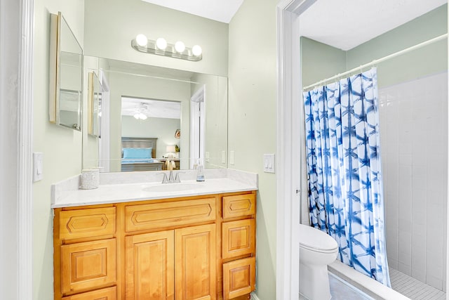 ensuite bathroom with ensuite bath, a shower stall, toilet, and vanity