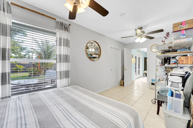 bedroom featuring ceiling fan and light tile patterned floors