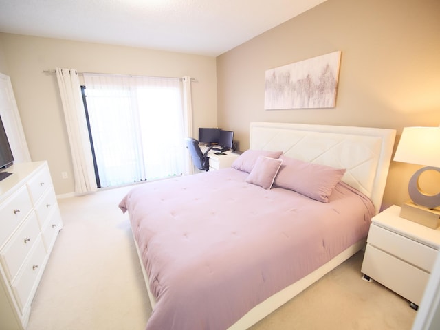 bedroom featuring light carpet