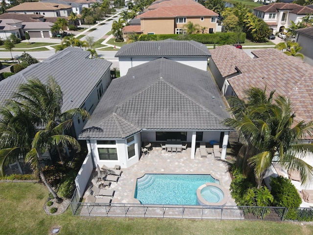 exterior space with a patio area, a fenced backyard, a residential view, and an outdoor living space