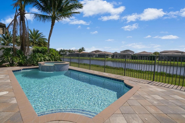 view of pool featuring a water view, a pool with connected hot tub, a residential view, and fence