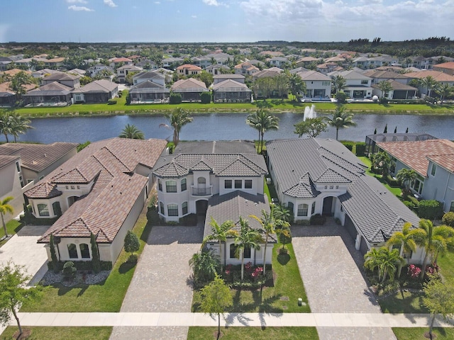 aerial view featuring a water view and a residential view