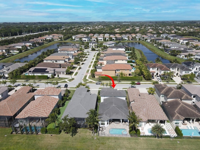 aerial view with a water view and a residential view