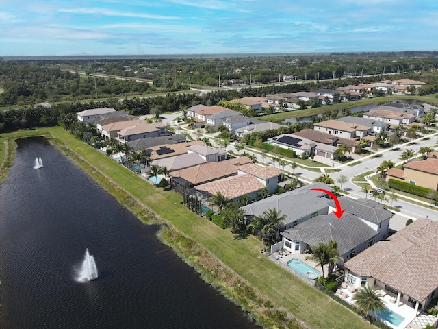 bird's eye view featuring a water view and a residential view