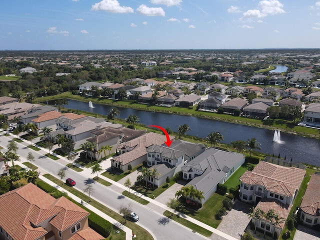 bird's eye view with a water view and a residential view