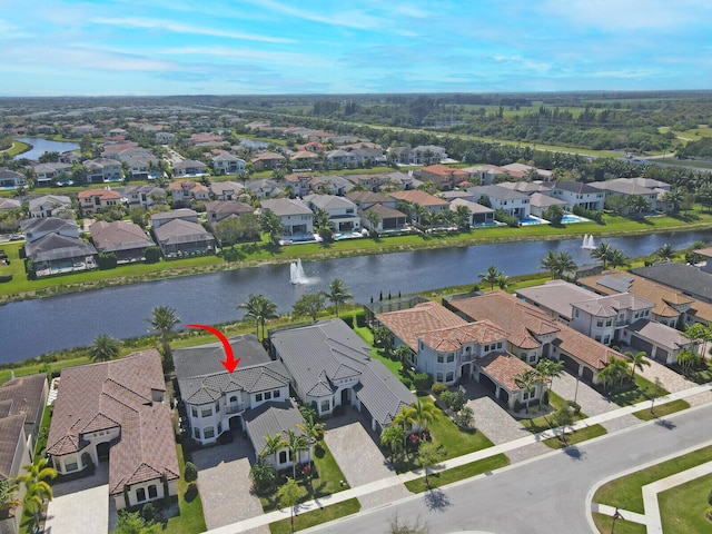 aerial view featuring a water view and a residential view