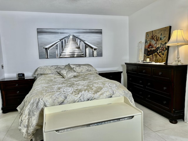 bedroom with light tile patterned floors