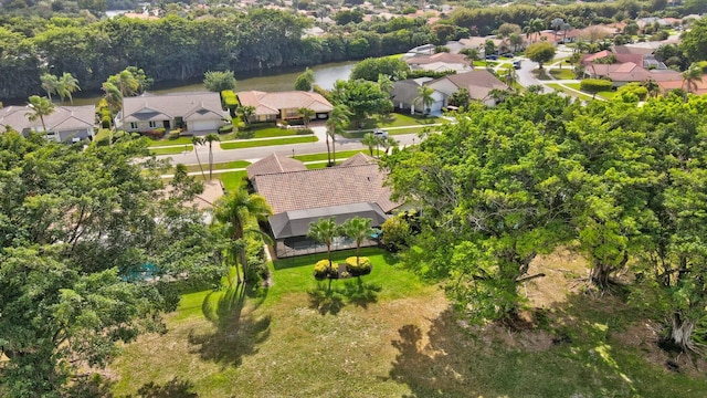 drone / aerial view featuring a residential view and a water view