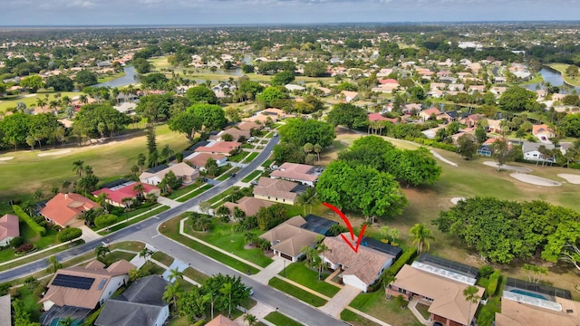 aerial view featuring a water view and a residential view