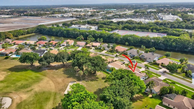 bird's eye view featuring a water view and a residential view