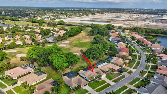 birds eye view of property featuring a water view and a residential view