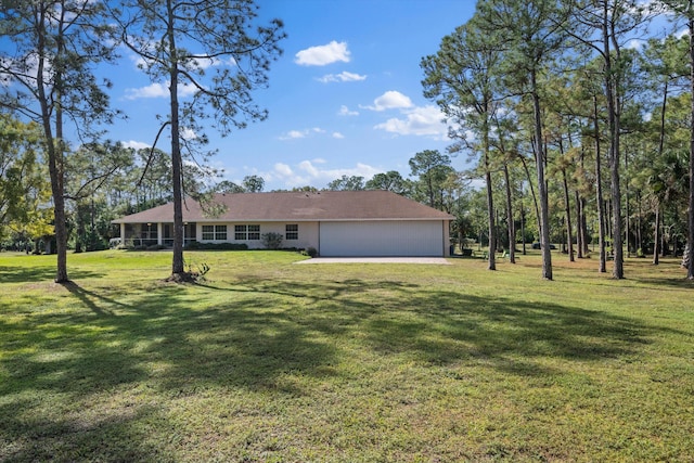 2891 SE Tailwinds Rd, Jupiter, FL 33478 - view of front of house featuring an attached garage and a front lawn