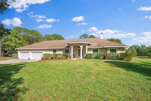 ranch-style house with a garage, concrete driveway, stucco siding, a front lawn, and a chimney