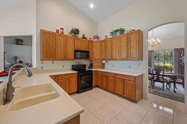 2891 SE Tailwinds Rd, Jupiter, FL 33478 - kitchen featuring black appliances, high vaulted ceiling, light tile patterned flooring, arched walkways, and a chandelier