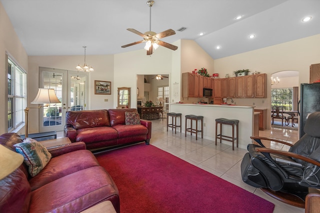 2891 SE Tailwinds Rd, Jupiter, FL 33478 - living room with a chandelier, light tile patterned floors, ceiling fan, high vaulted ceiling, and recessed lighting