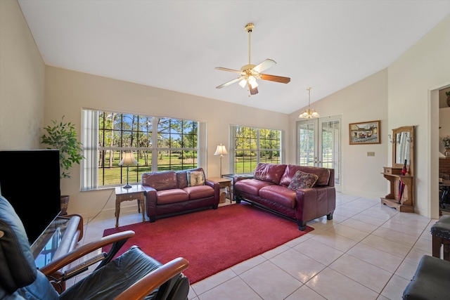 2891 SE Tailwinds Rd, Jupiter, FL 33478 - living room featuring lofted ceiling, healthy amount of natural light, light tile patterned flooring, ceiling fan, and french doors