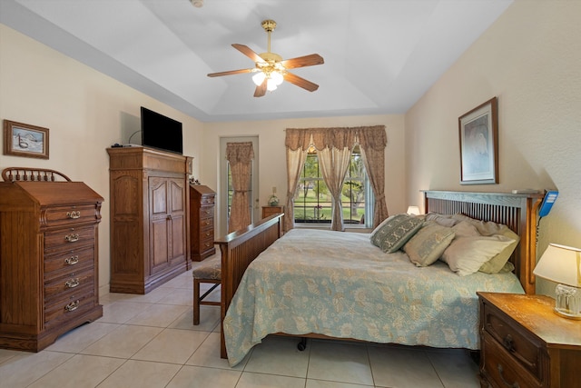 2891 SE Tailwinds Rd, Jupiter, FL 33478 - bedroom featuring a raised ceiling, light tile patterned floors, and a ceiling fan