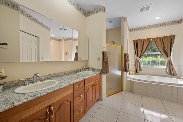 2891 SE Tailwinds Rd, Jupiter, FL 33478 - full bath featuring a shower stall, double vanity, a garden tub, and tile patterned floors