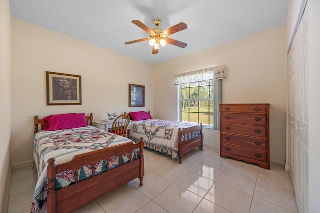 2891 SE Tailwinds Rd, Jupiter, FL 33478 - bedroom featuring a closet, a ceiling fan, and light tile patterned flooring