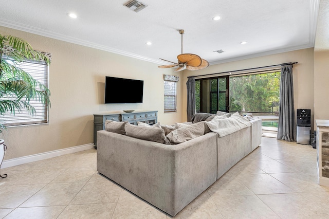 living area with light tile patterned floors, ornamental molding, visible vents, and baseboards