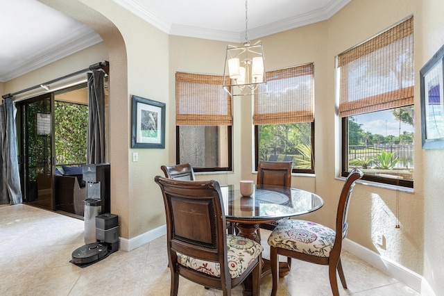 dining area with an inviting chandelier, arched walkways, a wealth of natural light, and crown molding