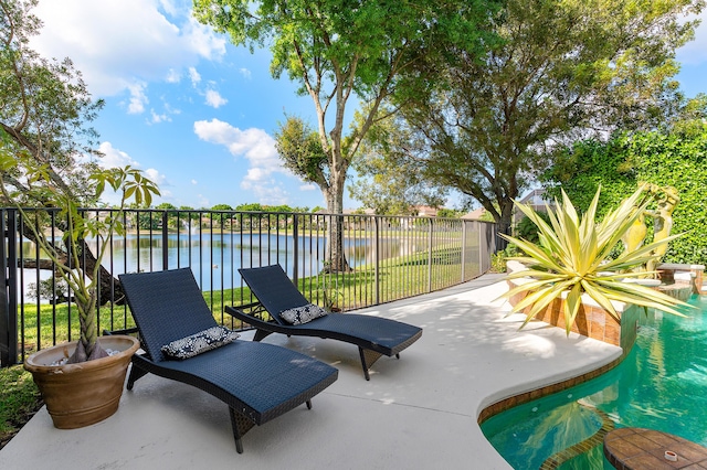 view of patio featuring a water view