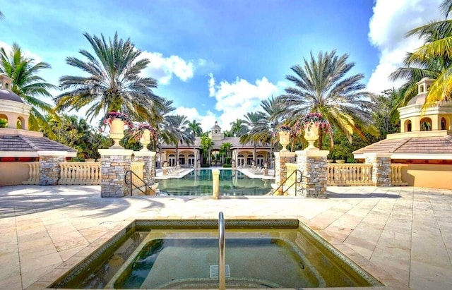 view of pool featuring a hot tub