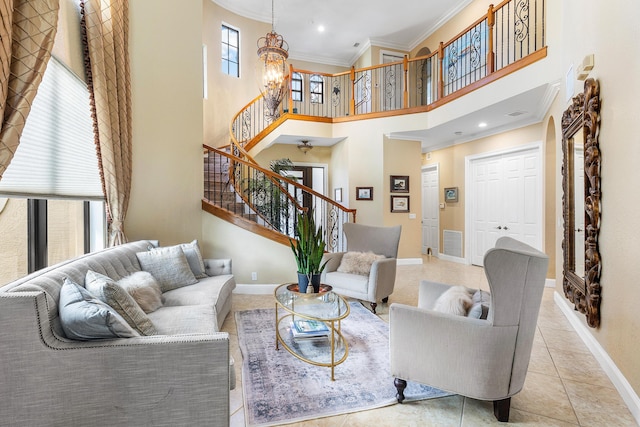 tiled living room featuring stairs, ornamental molding, visible vents, and baseboards