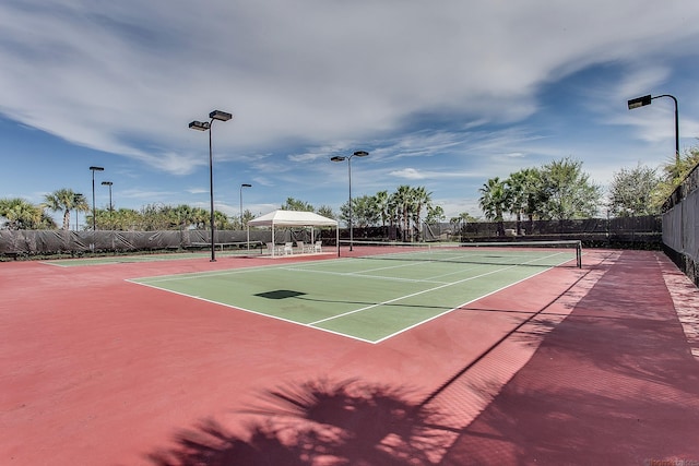 11603 SW Lake Park Dr, Port Saint Lucie, FL 34987 - view of tennis court featuring fence