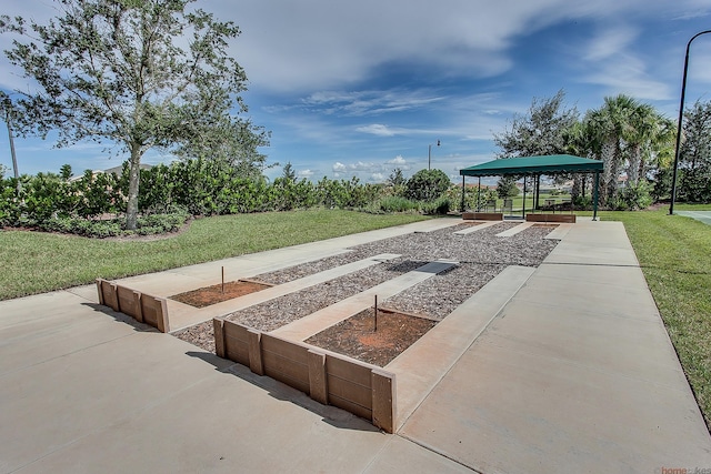 11603 SW Lake Park Dr, Port Saint Lucie, FL 34987 - view of property's community with a lawn and a gazebo