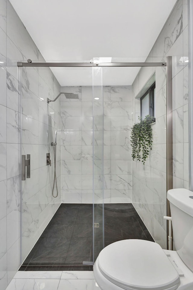 full bathroom with marble finish floor, a marble finish shower, and toilet