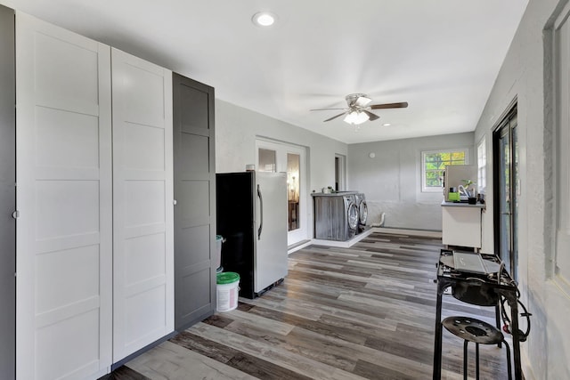 kitchen with ceiling fan, washer / clothes dryer, wood finished floors, freestanding refrigerator, and recessed lighting