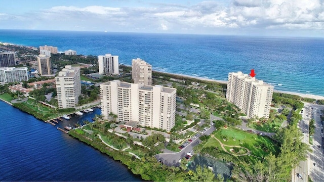 birds eye view of property with a view of city and a water view