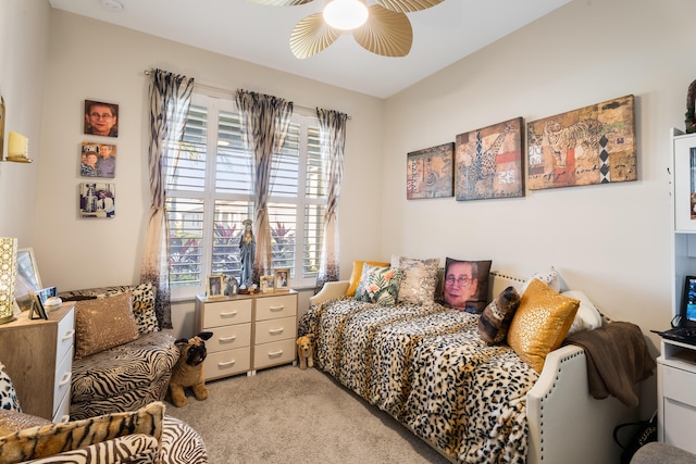 bedroom featuring light colored carpet and ceiling fan