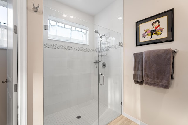 full bath featuring a shower stall