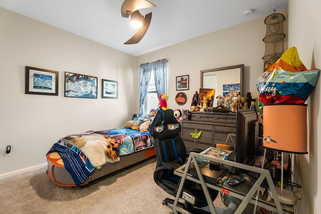 carpeted bedroom featuring ceiling fan and baseboards