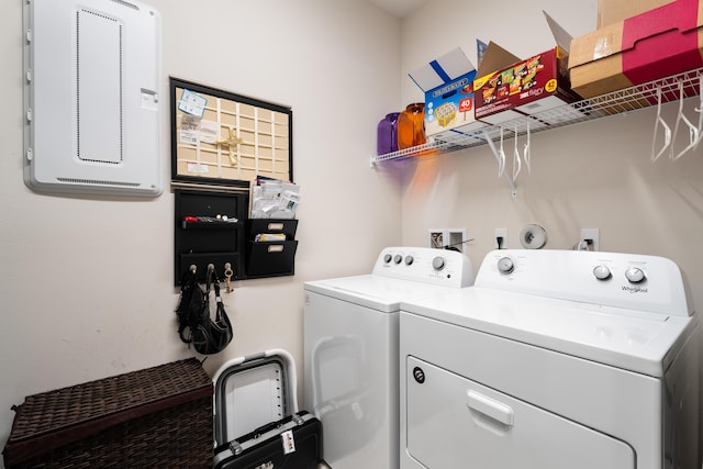 clothes washing area with washing machine and dryer and laundry area