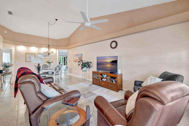 living area featuring light tile patterned floors, visible vents, high vaulted ceiling, baseboards, and ceiling fan with notable chandelier