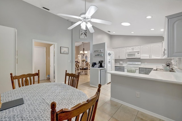 dining room featuring light tile patterned floors, visible vents, ceiling fan with notable chandelier, high vaulted ceiling, and recessed lighting