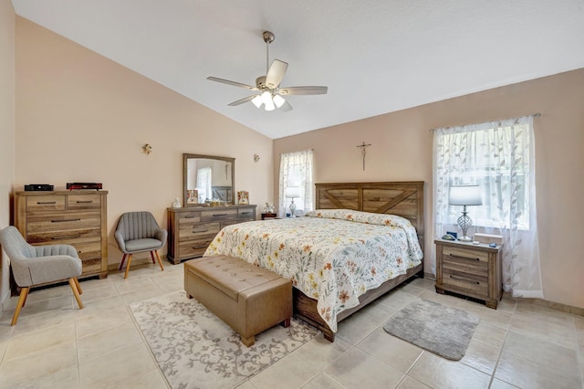 bedroom with lofted ceiling, ceiling fan, baseboards, and light tile patterned floors