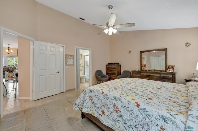 bedroom featuring light tile patterned floors, high vaulted ceiling, visible vents, and ensuite bathroom