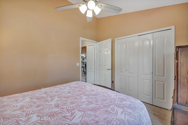 bedroom with a ceiling fan, a closet, and light tile patterned flooring