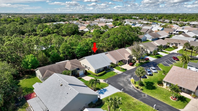 birds eye view of property with a residential view