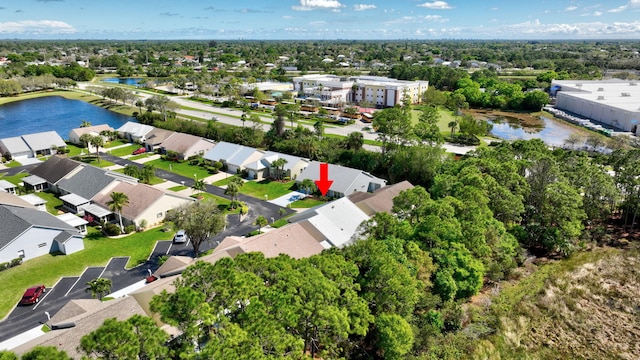 bird's eye view featuring a water view and a residential view