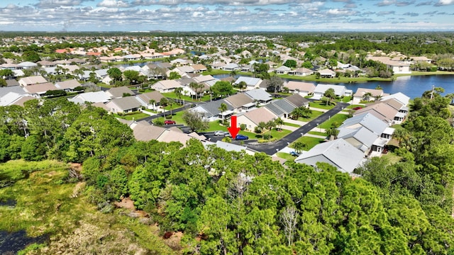 bird's eye view featuring a water view and a residential view