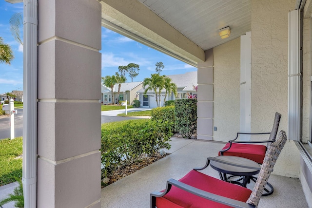 view of patio featuring a residential view and covered porch