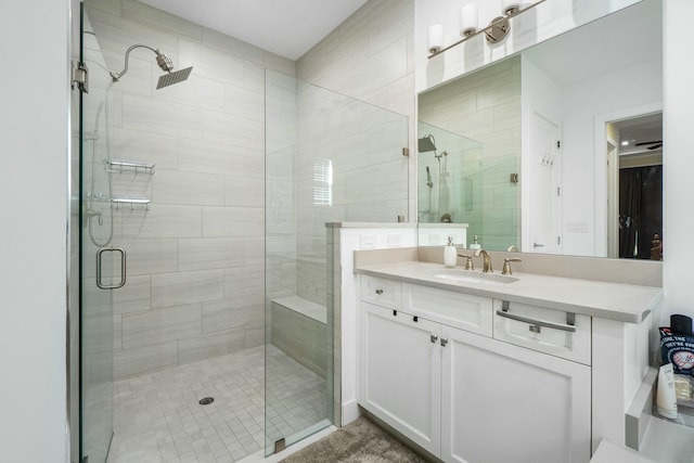 full bathroom with a stall shower and vanity