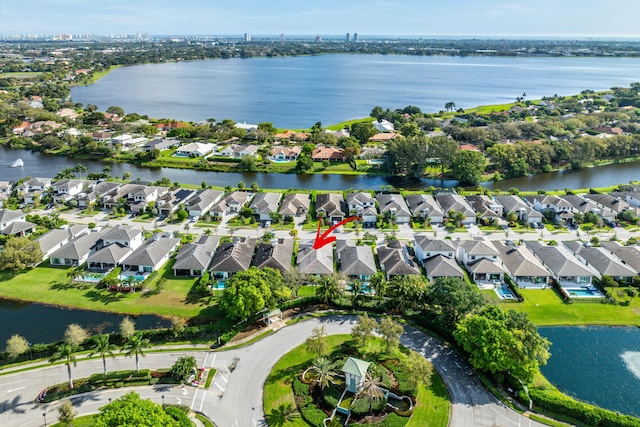 bird's eye view featuring a residential view and a water view