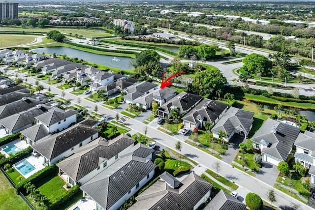 aerial view with a water view and a residential view