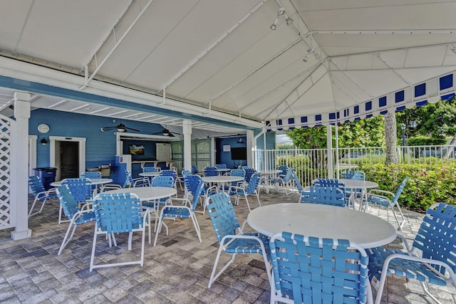 sunroom / solarium featuring a ceiling fan and lofted ceiling